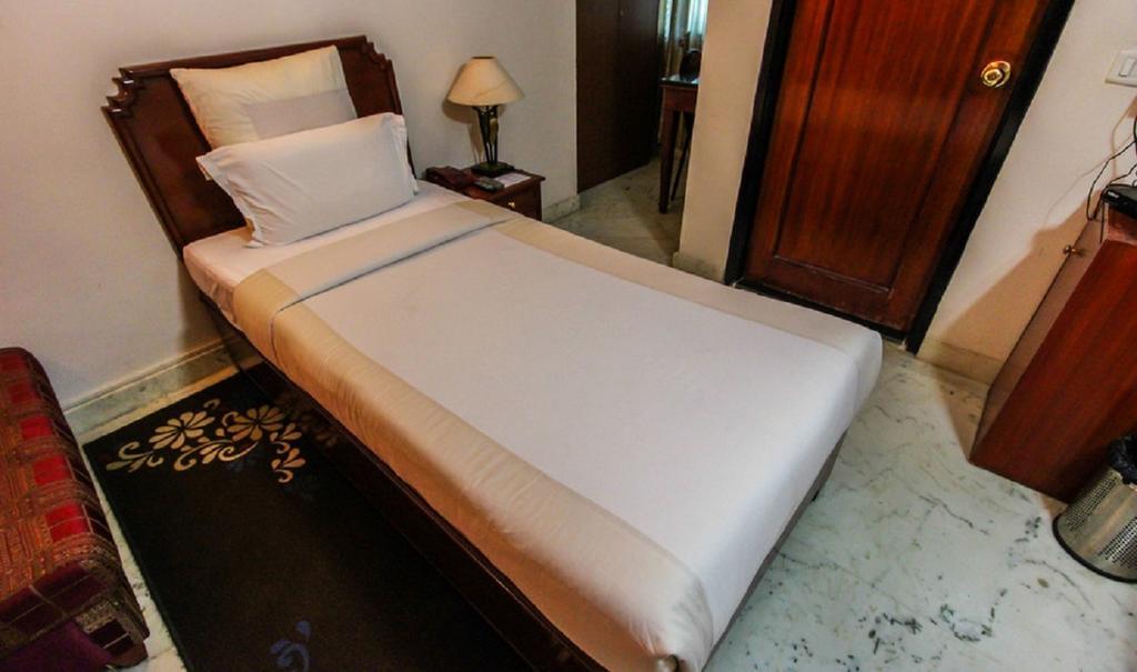 Hotel Pigeon International Bengaluru Szoba fotó