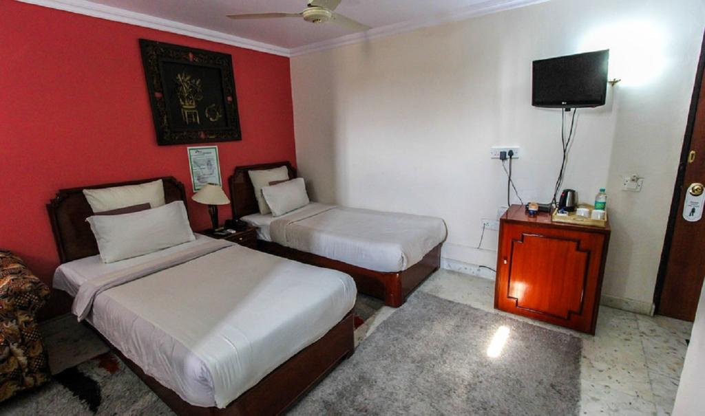 Hotel Pigeon International Bengaluru Szoba fotó