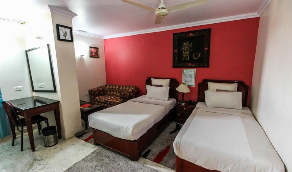 Hotel Pigeon International Bengaluru Szoba fotó