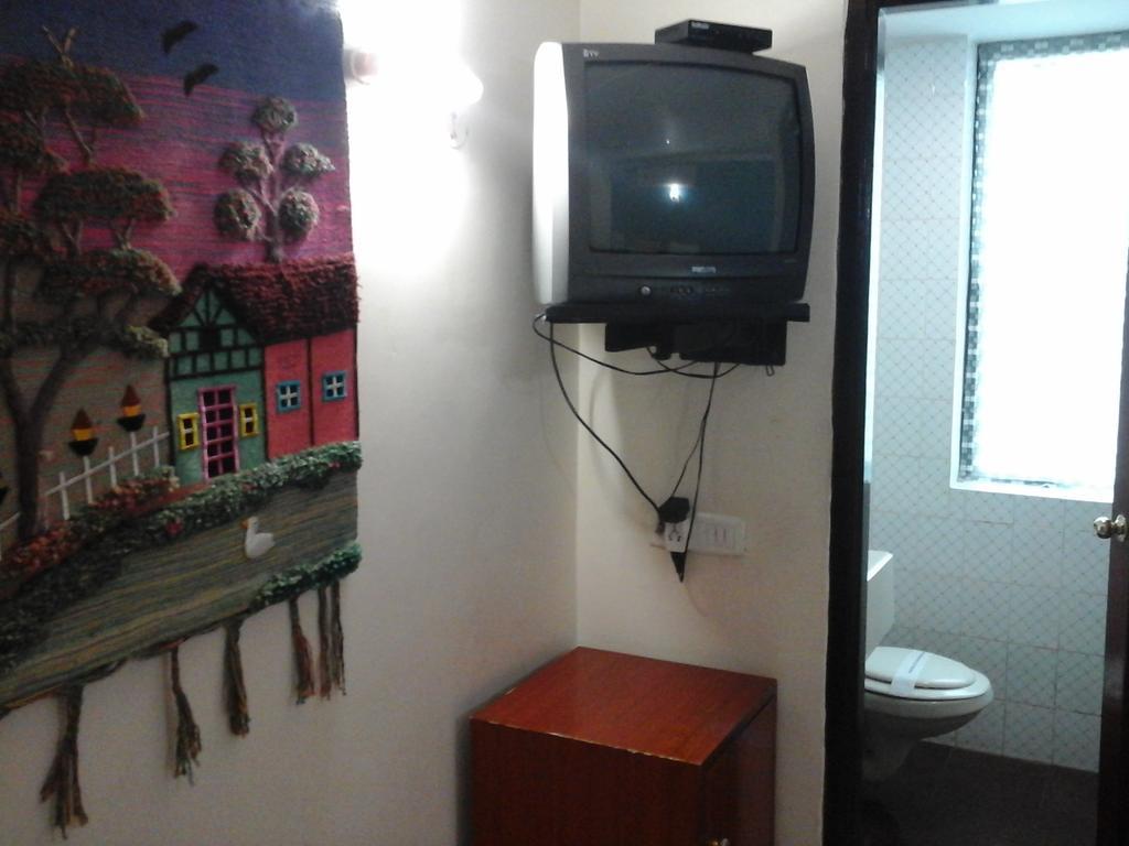 Hotel Pigeon International Bengaluru Szoba fotó
